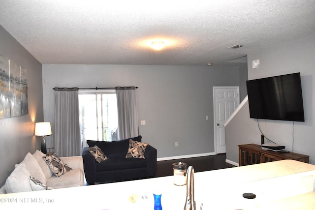 living room with a textured ceiling