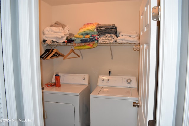 clothes washing area featuring independent washer and dryer