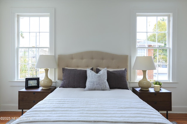 bedroom with hardwood / wood-style flooring