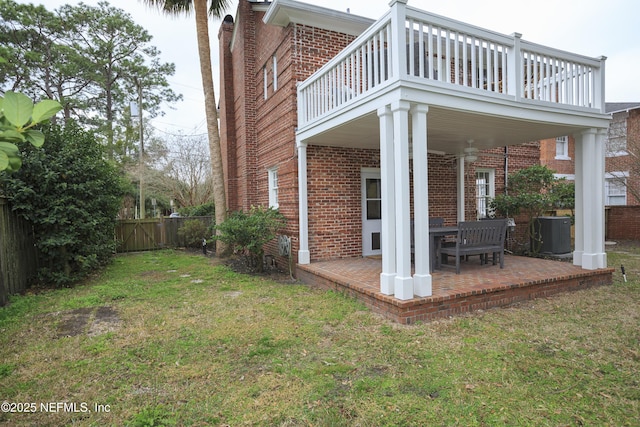 exterior space with a patio, a balcony, and central AC