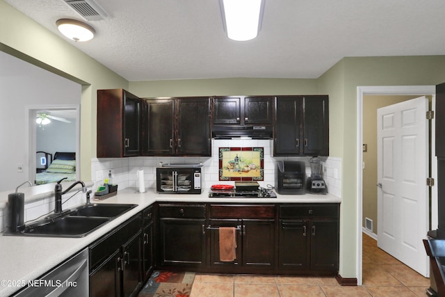 kitchen featuring dishwasher, black gas cooktop, sink, a textured ceiling, and light tile patterned flooring