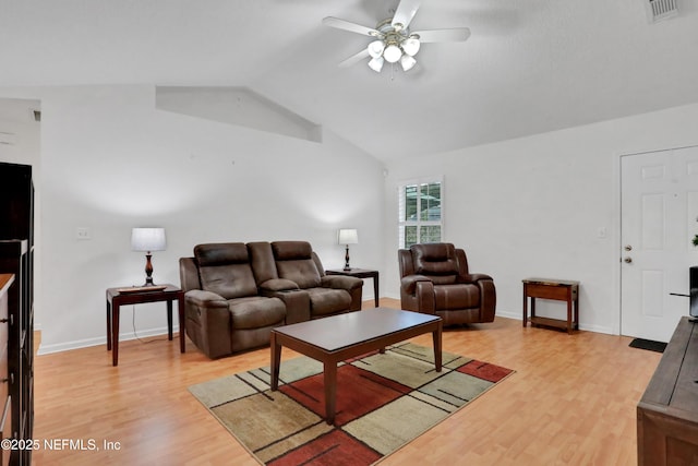 living room with wood-type flooring, vaulted ceiling, and ceiling fan