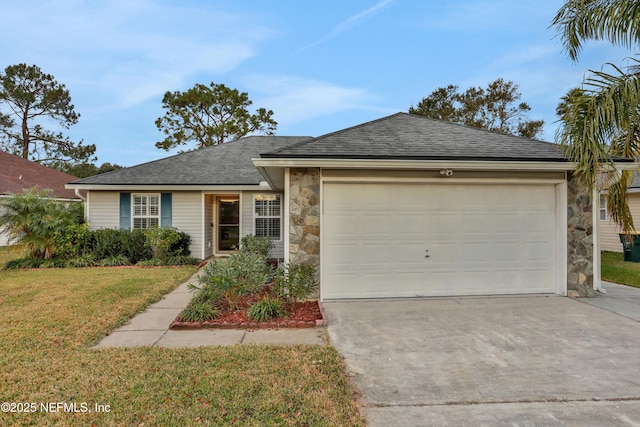 ranch-style house featuring a front yard and a garage