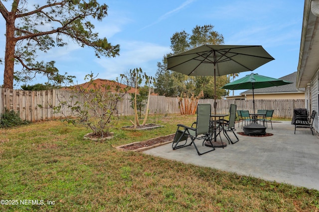 view of yard with an outdoor fire pit and a patio area