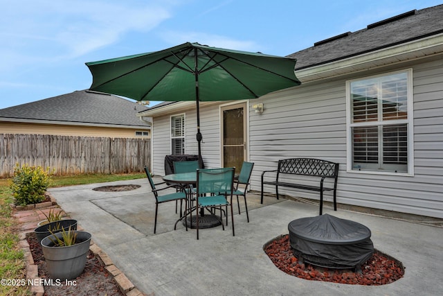 view of patio / terrace with an outdoor fire pit