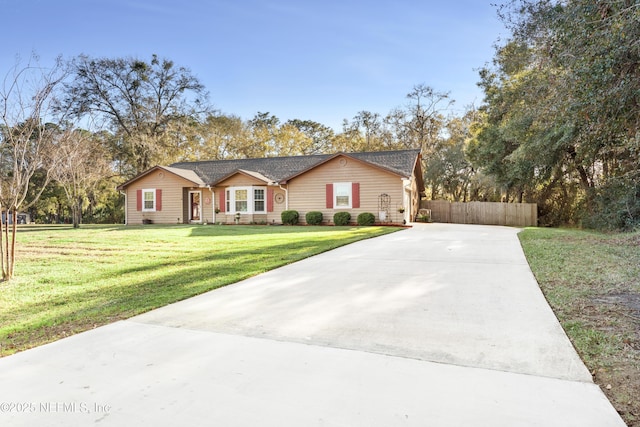 ranch-style home with a front yard