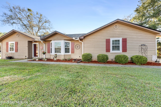 single story home featuring a front yard