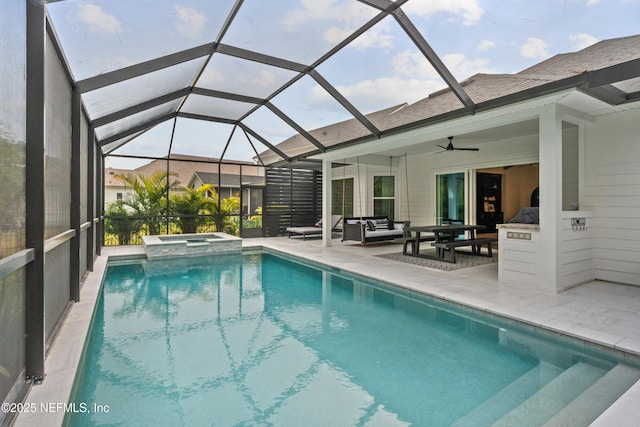 view of pool with ceiling fan, a patio area, an in ground hot tub, glass enclosure, and an outdoor hangout area