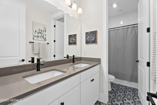 bathroom with toilet, a shower with shower curtain, tile patterned floors, and vanity