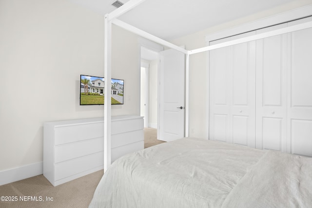 carpeted bedroom featuring a closet