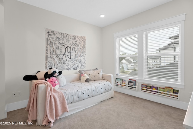 bedroom featuring light carpet