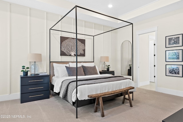 bedroom featuring light colored carpet