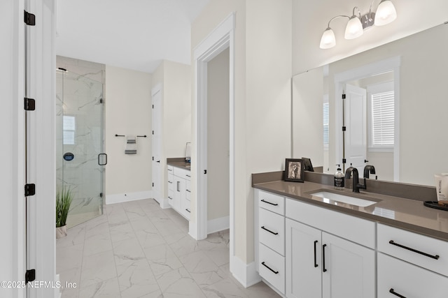 bathroom with an enclosed shower and vanity