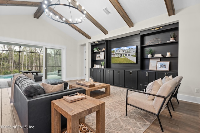 living room with built in shelves, a notable chandelier, and vaulted ceiling with beams