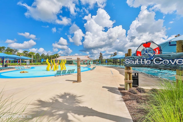 view of pool featuring a playground