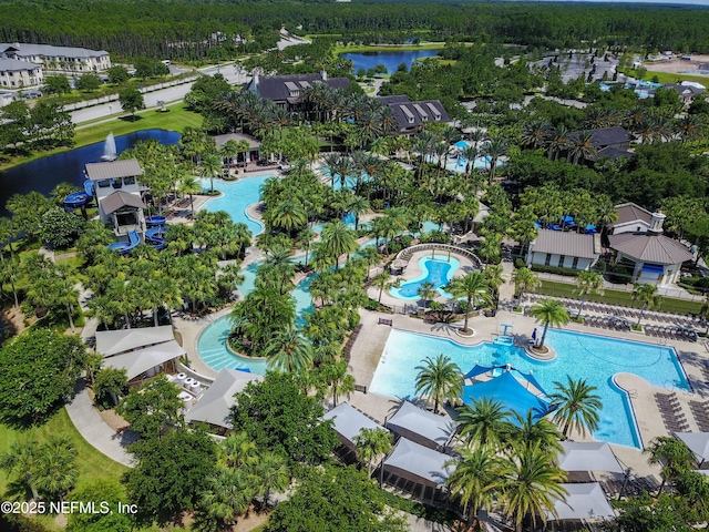 birds eye view of property with a water view