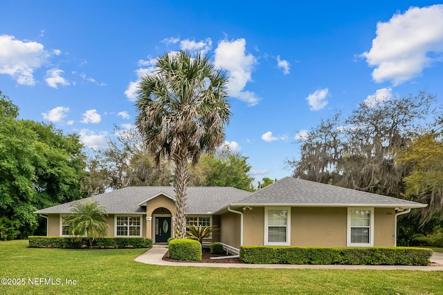 ranch-style home featuring a front yard