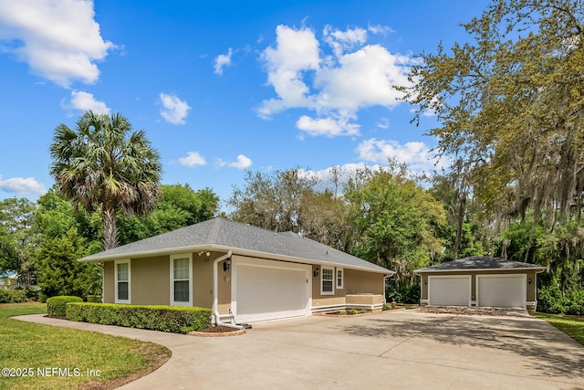 ranch-style home featuring an outbuilding