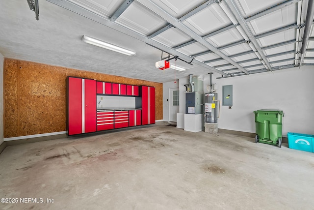 garage with a garage door opener, electric panel, and water heater