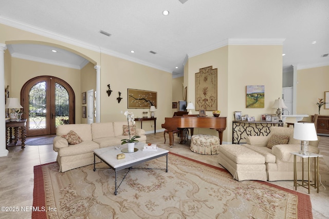 living room featuring light tile patterned flooring, ornate columns, ornamental molding, and french doors