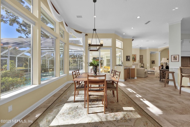 dining area with crown molding