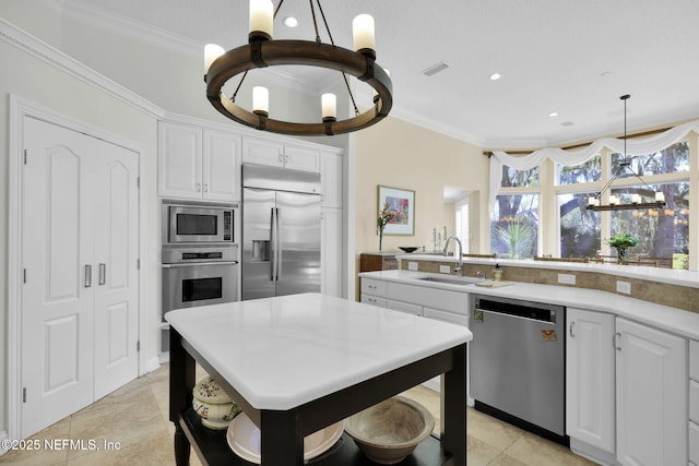 kitchen featuring sink, white cabinets, built in appliances, and light tile patterned flooring