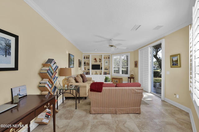 living room featuring ceiling fan, built in features, and crown molding