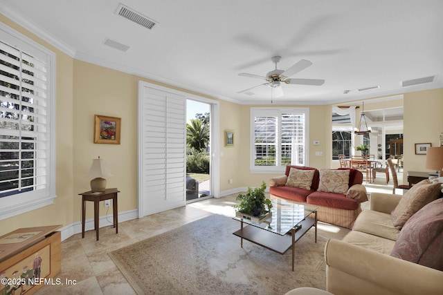 living room with crown molding and ceiling fan with notable chandelier