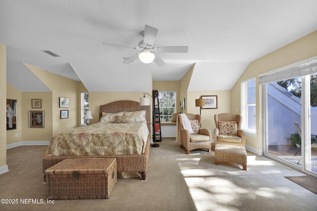 carpeted bedroom featuring ceiling fan, a textured ceiling, lofted ceiling, and access to outside