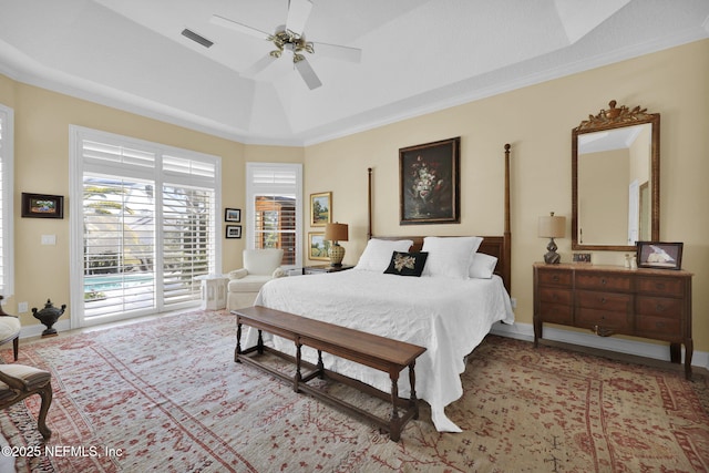 bedroom with ceiling fan, crown molding, a raised ceiling, and access to outside