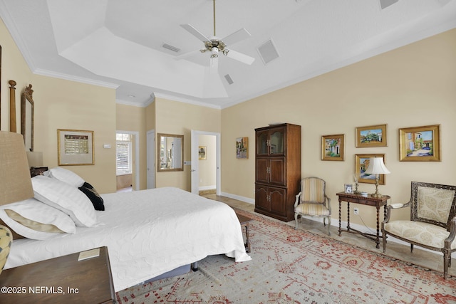 bedroom featuring ceiling fan, crown molding, and a raised ceiling