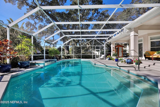 view of swimming pool with a patio and glass enclosure