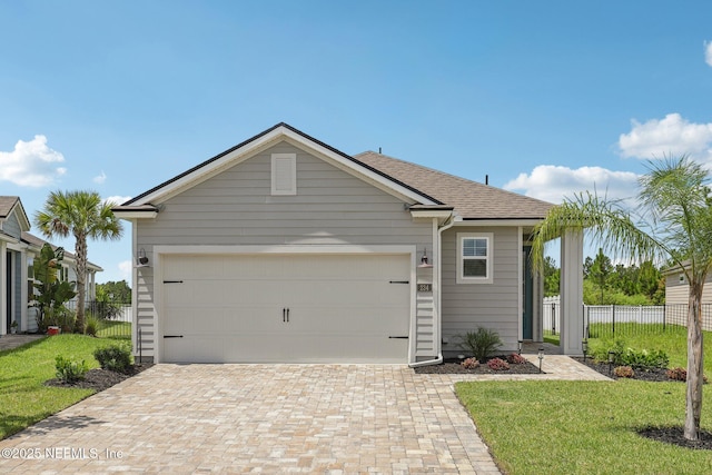 234 Thistleton Way, Saint Augustine, FL 32092 - ranch-style home with decorative driveway, an attached garage, and a shingled roof