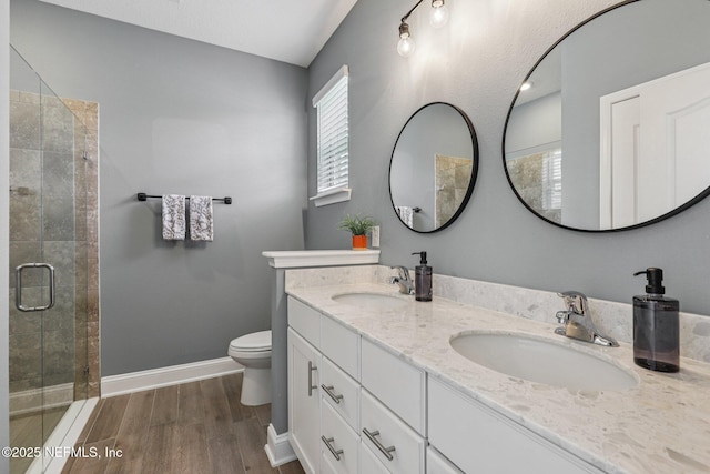 234 Thistleton Way, Saint Augustine, FL 32092 - full bath featuring a shower stall, double vanity, and wood finished floors