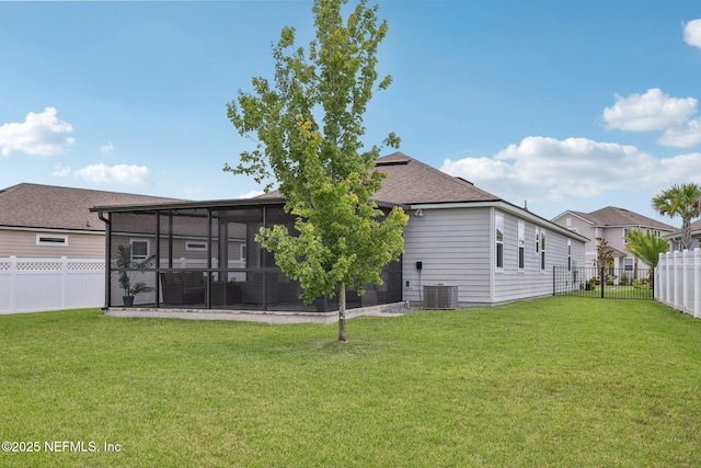 234 Thistleton Way, Saint Augustine, FL 32092 - back of house with a sunroom, a fenced backyard, and roof with shingles