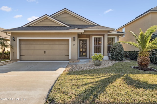 view of front of property with a front lawn and a garage