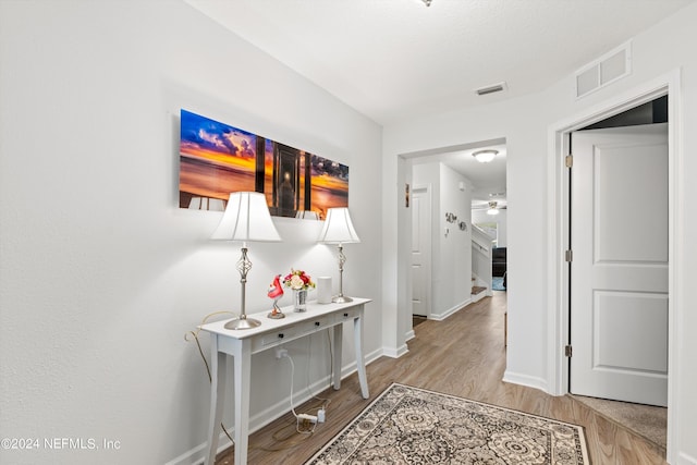 corridor featuring light hardwood / wood-style floors