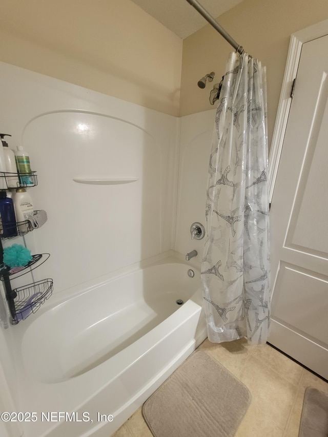 bathroom with shower / tub combo with curtain and tile patterned floors