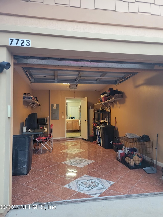 garage featuring a garage door opener and electric panel