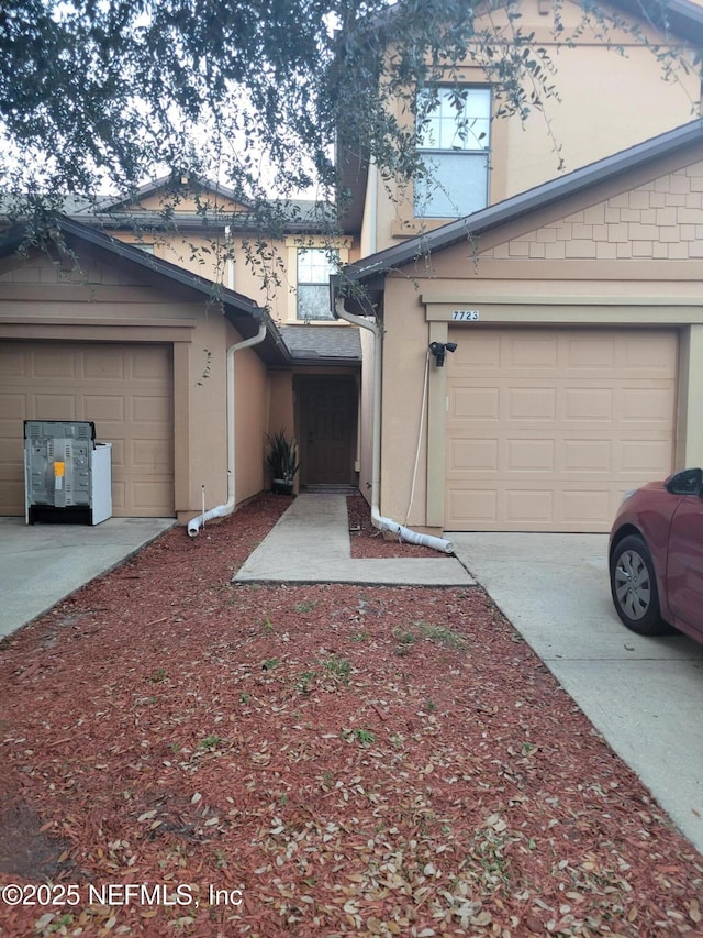 view of side of home with a garage