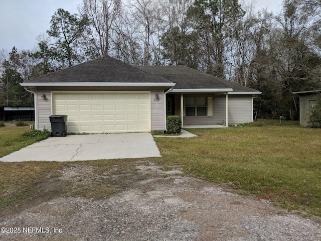 ranch-style home featuring a garage and a front lawn