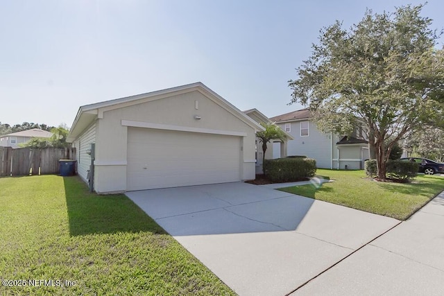 view of front of house featuring a garage and a front lawn