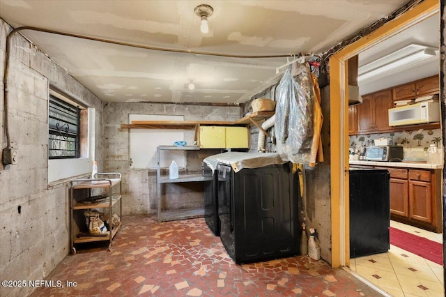 kitchen featuring washing machine and dryer