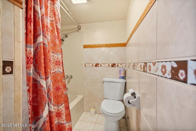 bathroom featuring shower / bath combo, tile walls, tile patterned floors, and toilet