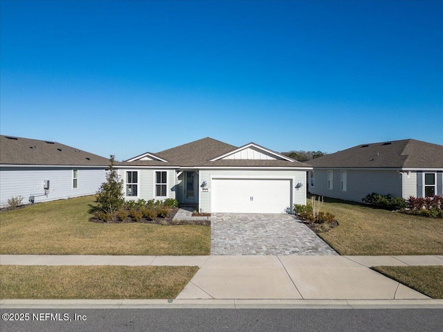 ranch-style home with a garage and a front yard