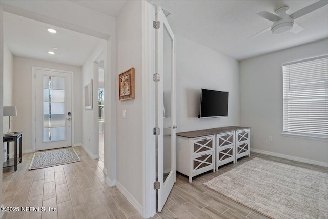 entryway featuring ceiling fan