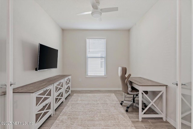 office space with ceiling fan