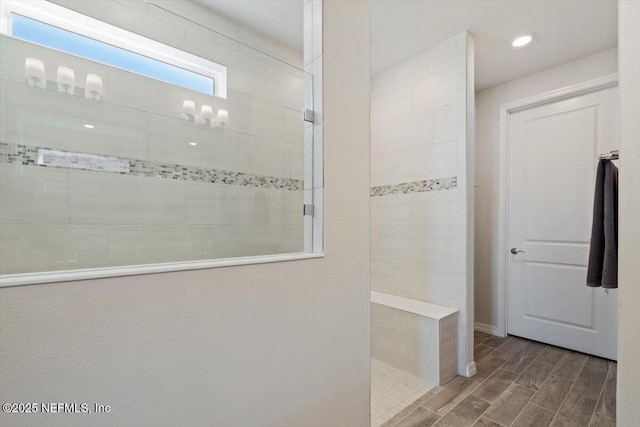 bathroom featuring tiled shower