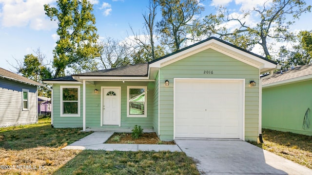 ranch-style home with a garage