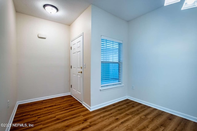 entrance foyer with dark hardwood / wood-style flooring